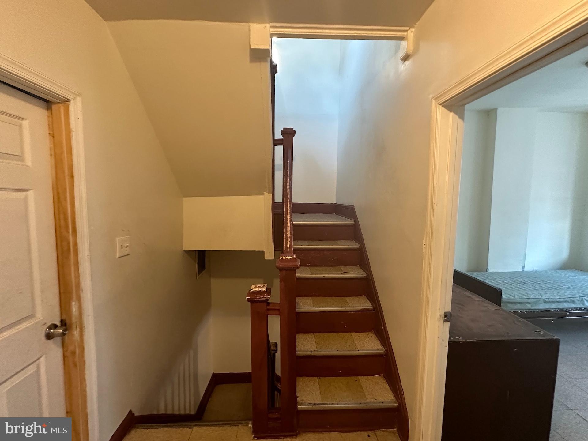 3926 Ridgewood Avenue Baltimore, MD 21215 - Photo 7 of 21 Inviting staircase leading to upper levels.