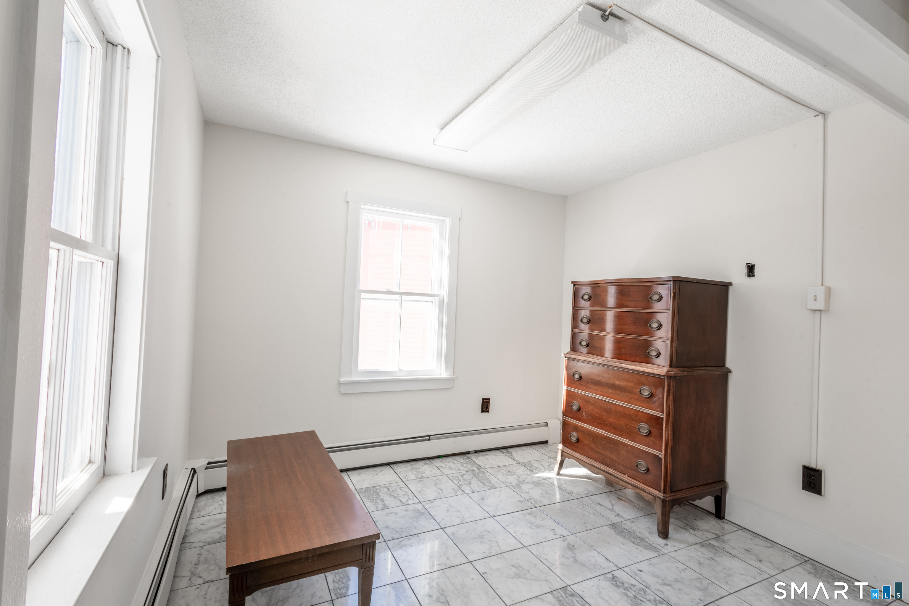 89 Hempstead Street New London, CT 06320 - Photo 11 of 14 a view of room with stairs and windows
