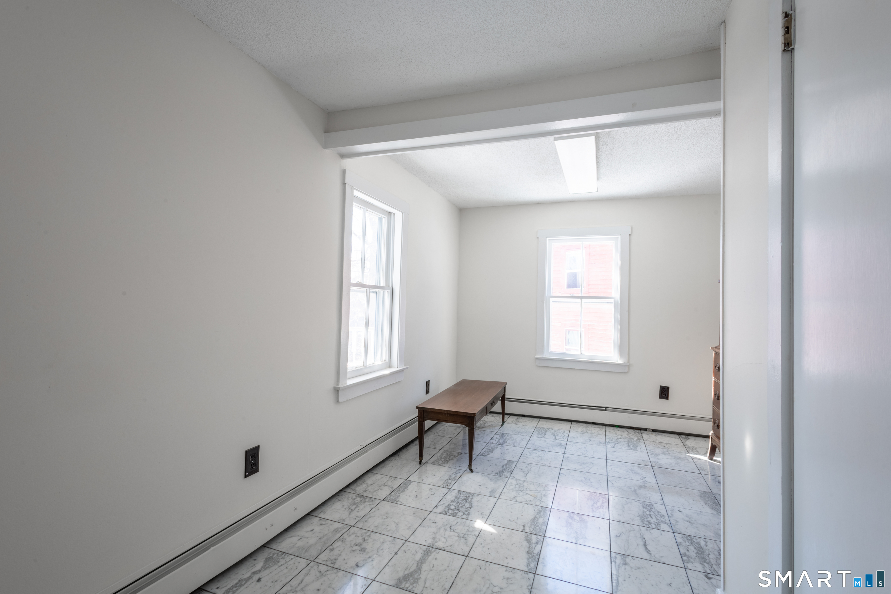 89 Hempstead Street New London, CT 06320 - Photo 10 of 14 a view of an empty room with a window