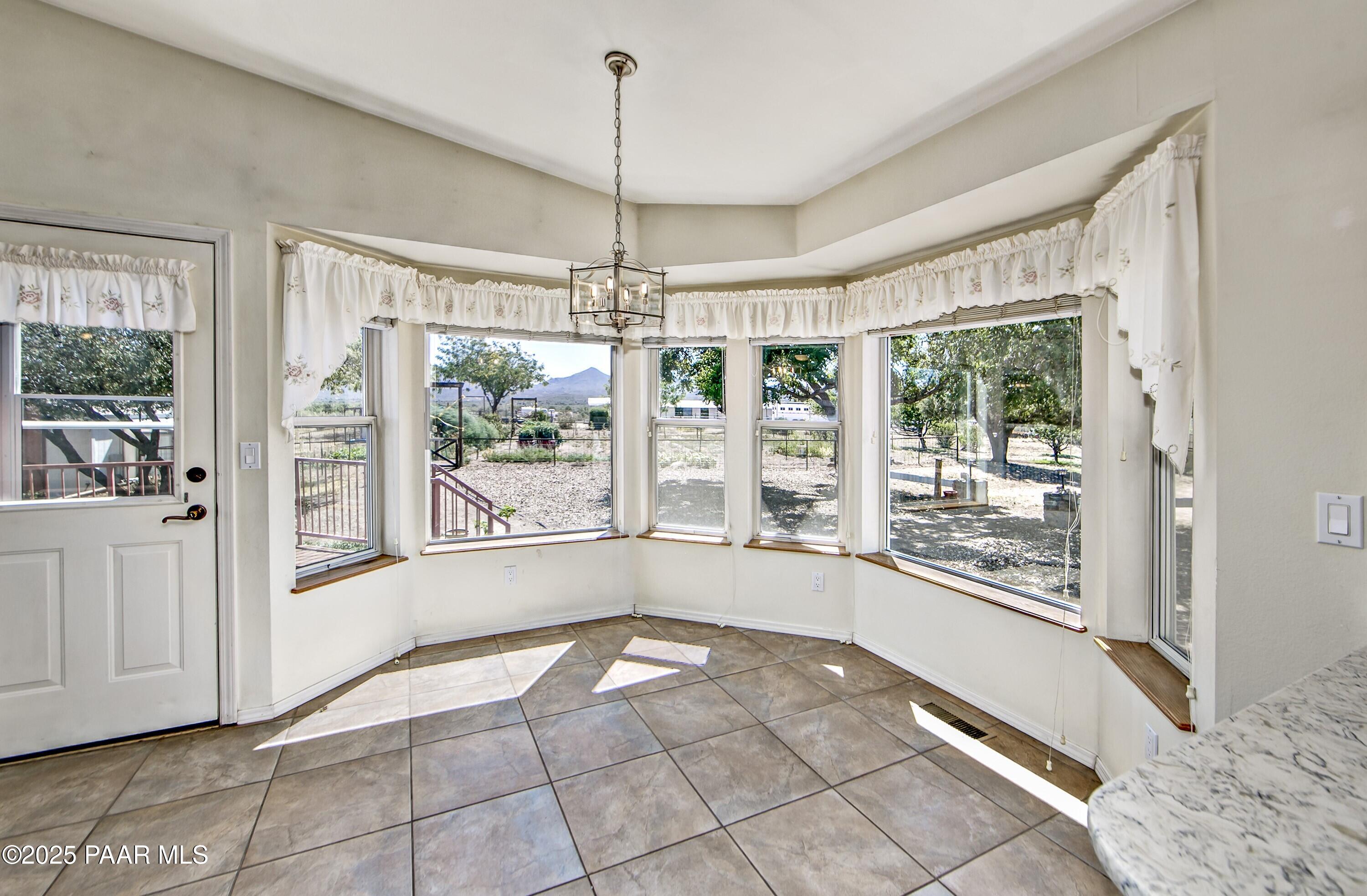 11800 West Faded Whistle Road Prescott, AZ 86305 - Photo 15 of 65 a view of an empty room with a window