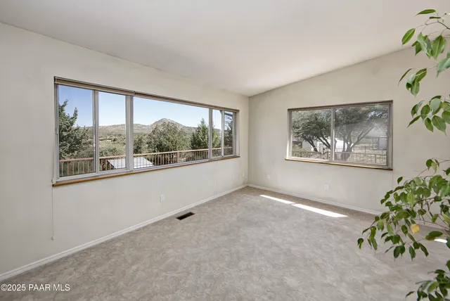 a kitchen with cabinets appliances a sink and a counter top space