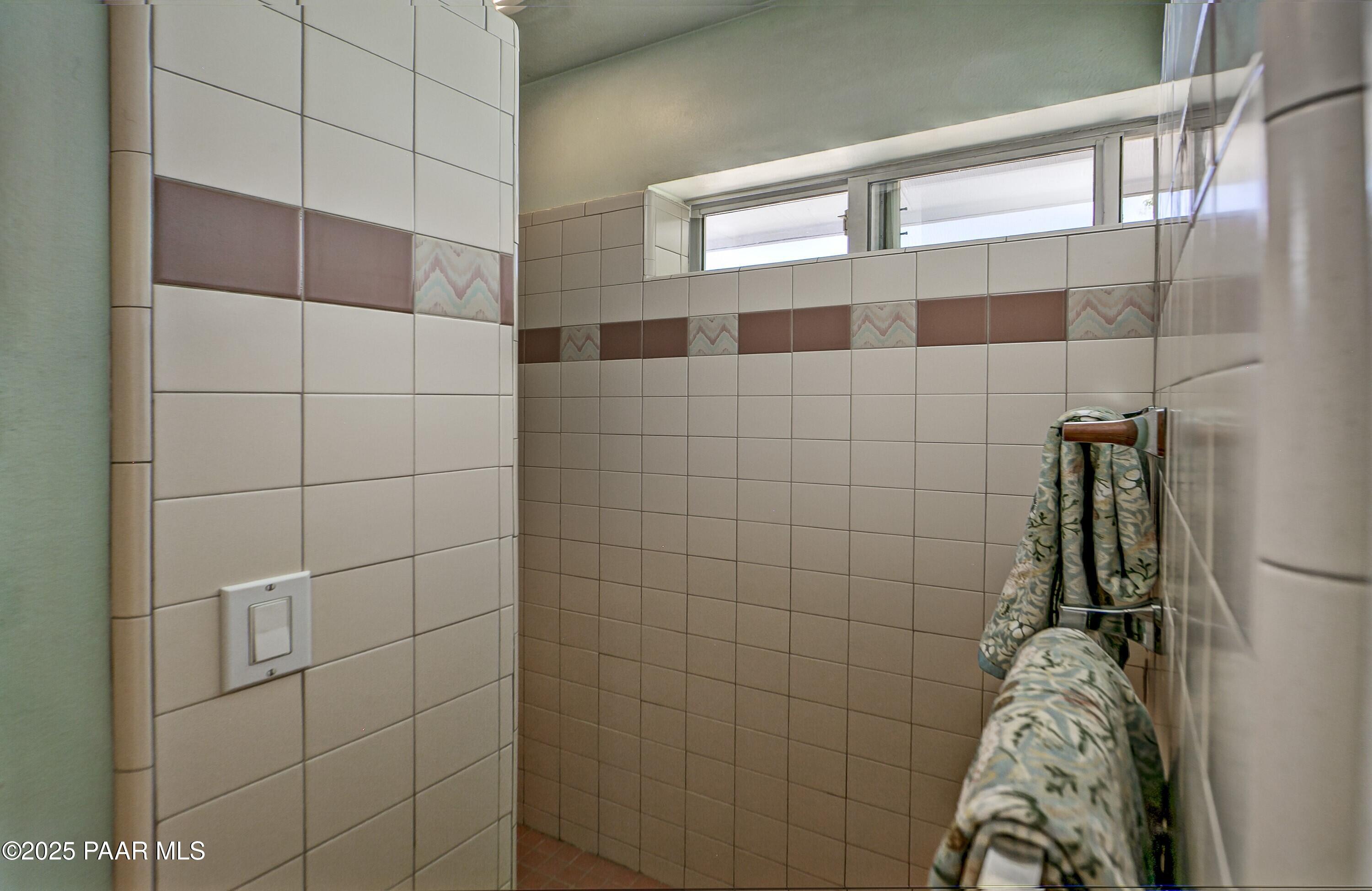 11800 West Faded Whistle Road Prescott, AZ 86305 - Photo 27 of 65 a bathroom with a shower