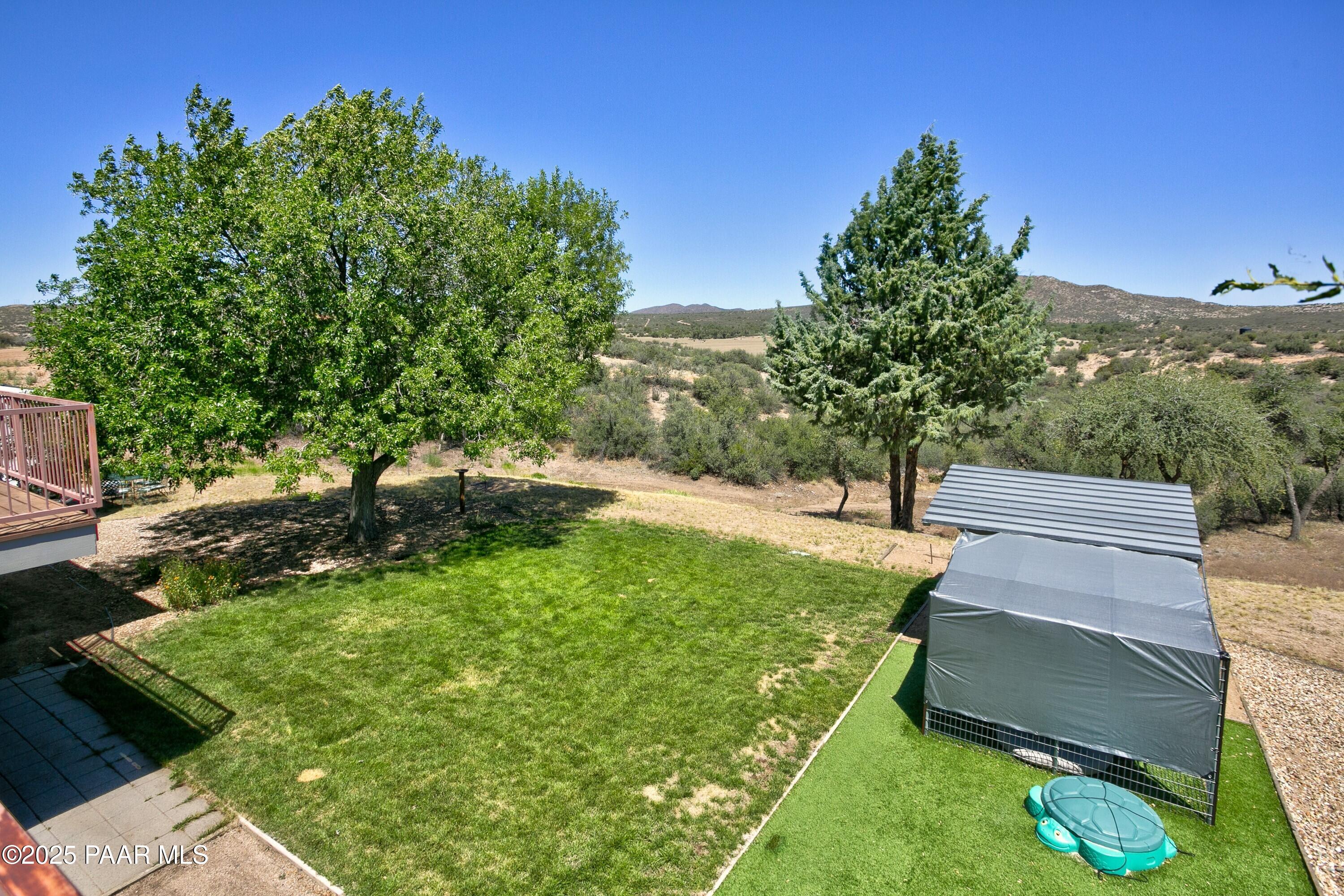 11800 West Faded Whistle Road Prescott, AZ 86305 - Photo 44 of 65 a garden view with a seating space