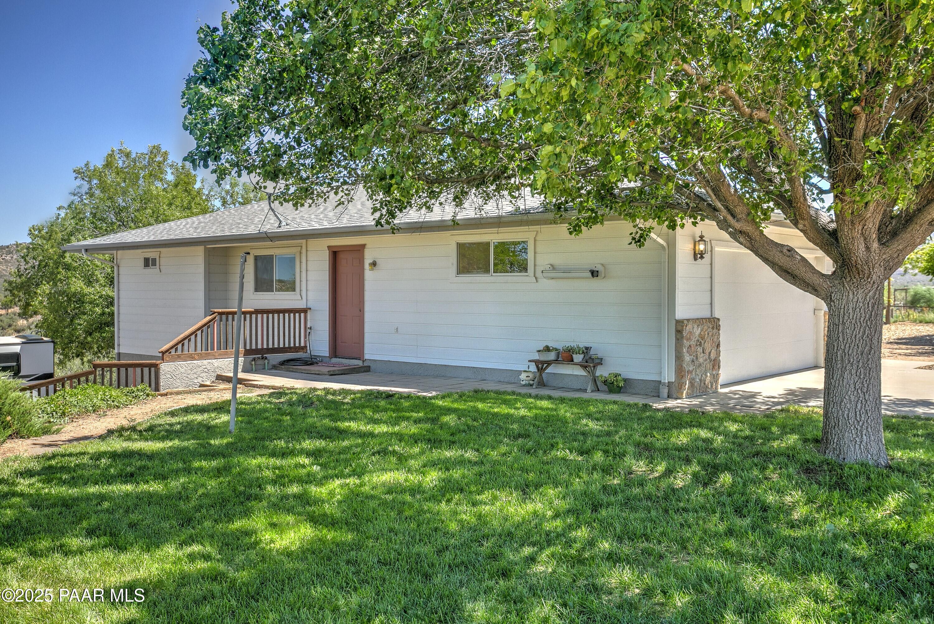 11800 West Faded Whistle Road Prescott, AZ 86305 - Photo 52 of 65 a view of a house with a yard