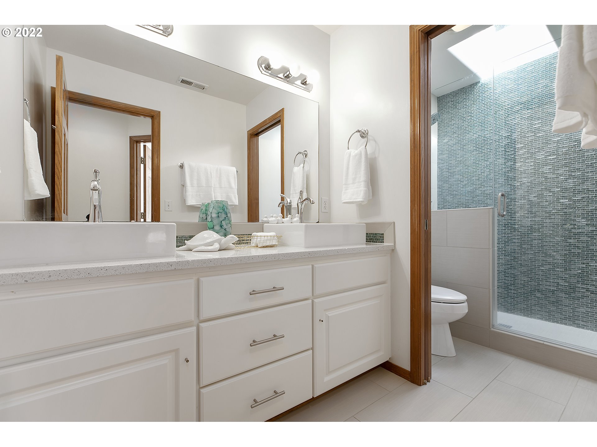 43221 Southeast Coalman Road Sandy, OR 97055 - Photo 23 of 32 a bathroom with a double vanity sink toilet and shower