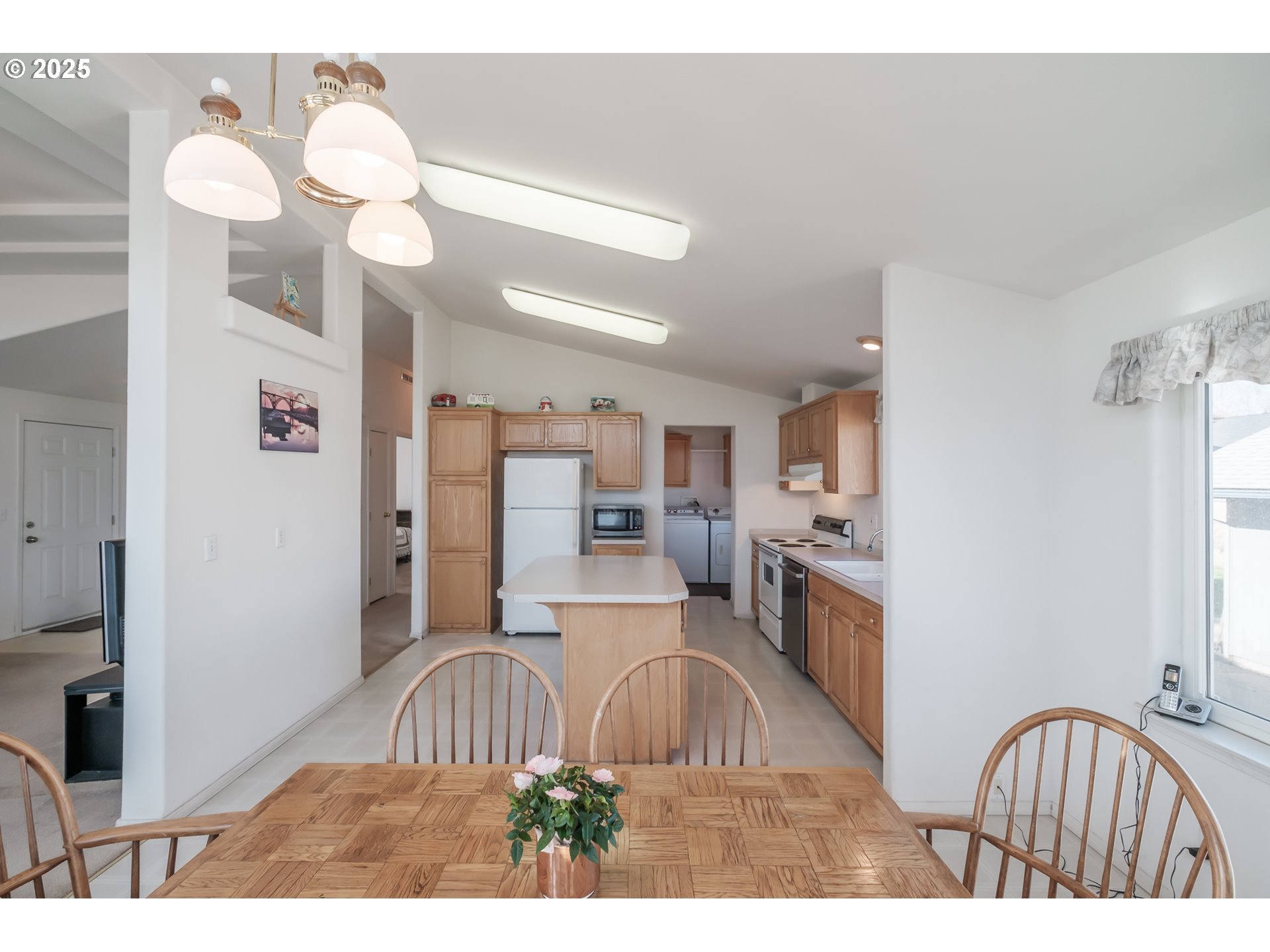 1015 Hoffman Road Northeast Salem, OR 97301 - Photo 5 of 47 a kitchen with kitchen island a refrigerator stove and a sink