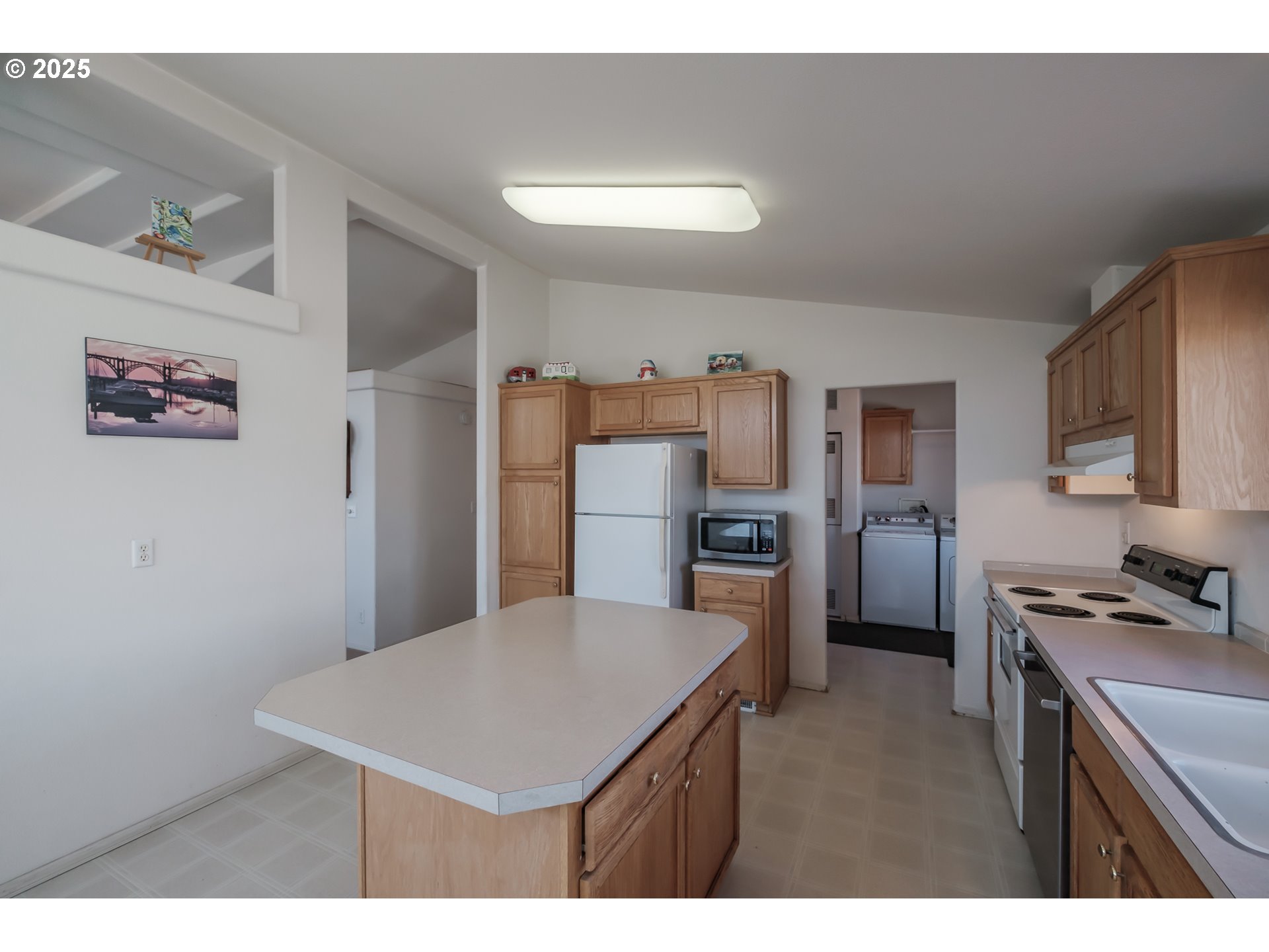 1015 Hoffman Road Northeast Salem, OR 97301 - Photo 8 of 47 a kitchen with cabinets and wooden floor