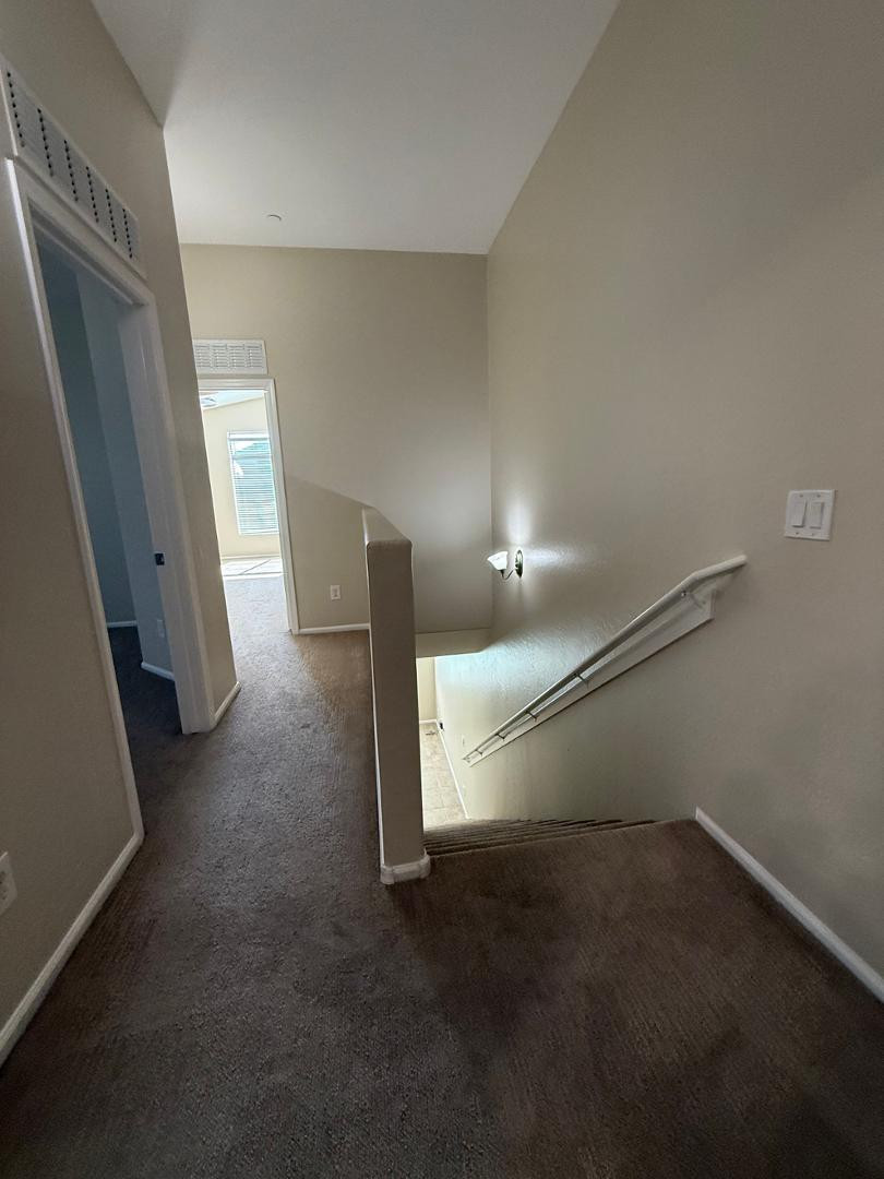 2725 East Mine Creek Road, Unit 1151 Phoenix, AZ 85024 - Photo 12 of 31 an empty room with a fireplace