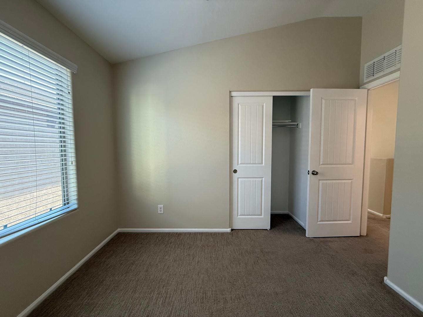 2725 East Mine Creek Road, Unit 1151 Phoenix, AZ 85024 - Photo 22 of 31 an empty room with windows and closet