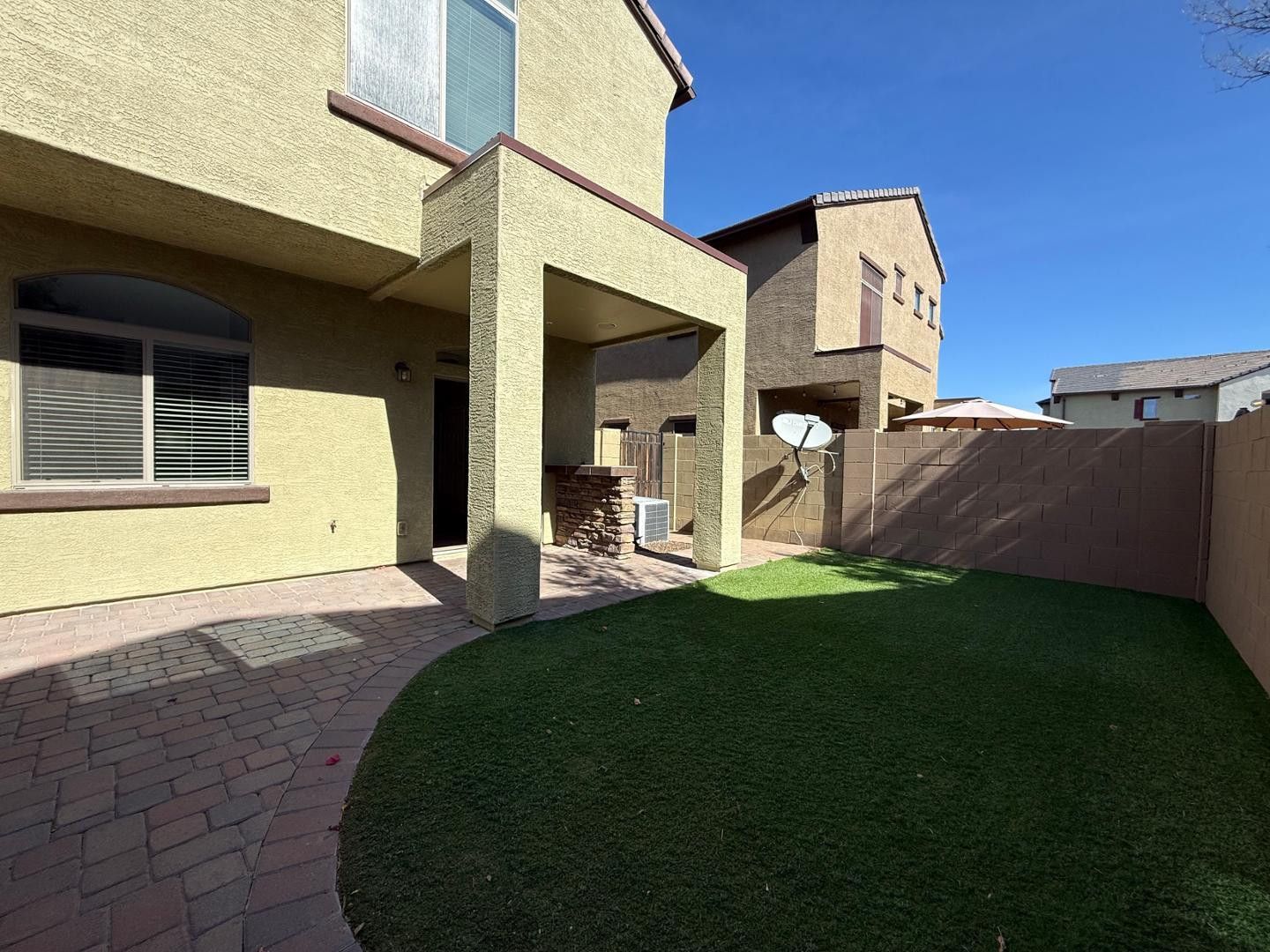 2725 East Mine Creek Road, Unit 1151 Phoenix, AZ 85024 - Photo 26 of 31 a view of a house with backyard and porch