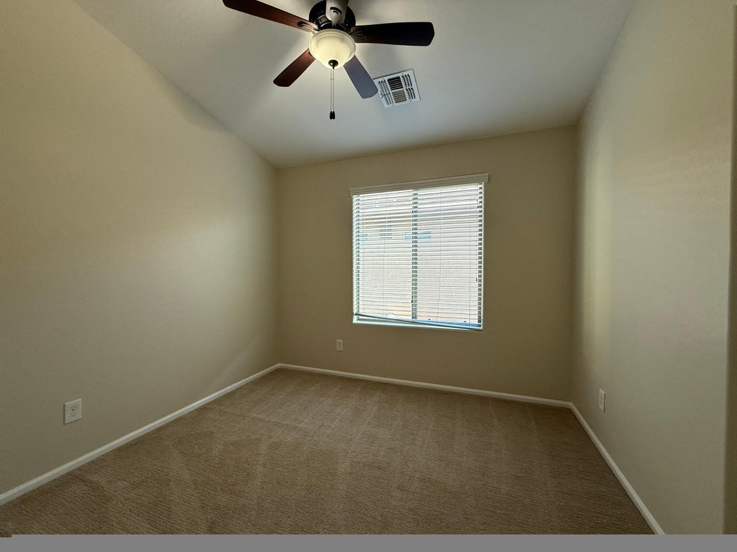 2725 East Mine Creek Road, Unit 1151 Phoenix, AZ 85024 - Photo 31 of 31 an empty room with a window and a fan