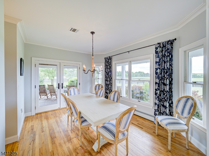 33 Kappus Road Milford, NJ 08848 - Photo 31 of 50 a view of a dining room with furniture wooden floor and chandelier