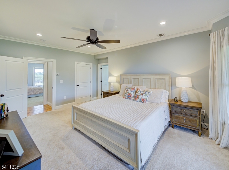 33 Kappus Road Milford, NJ 08848 - Photo 34 of 50 a spacious bedroom with a bed and a chandelier