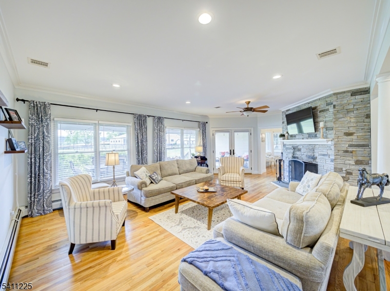 33 Kappus Road Milford, NJ 08848 - Photo 37 of 50 a living room with fireplace furniture and a wooden floor