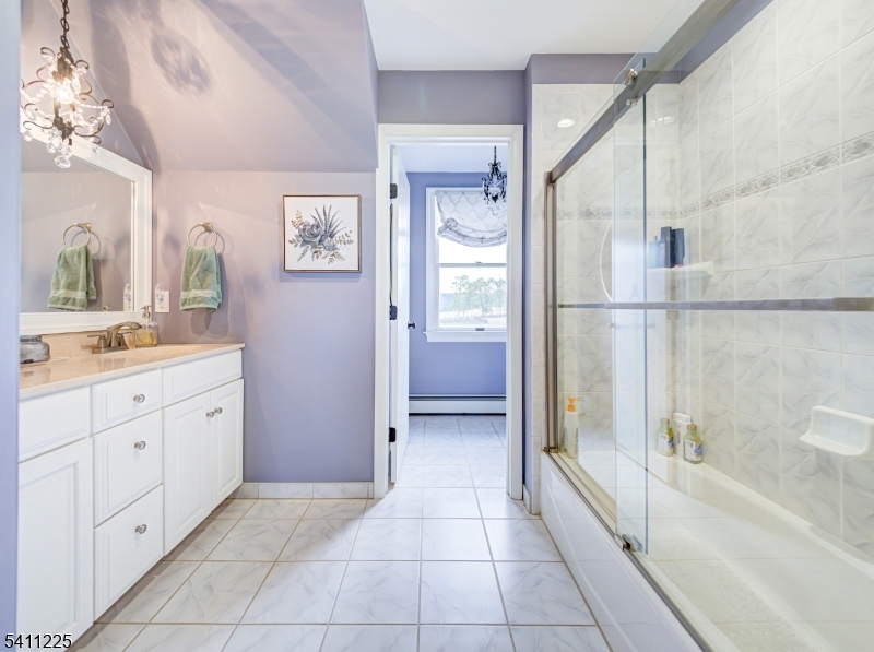 33 Kappus Road Milford, NJ 08848 - Photo 38 of 50 a bathroom with a granite countertop sink a mirror and a bathtub