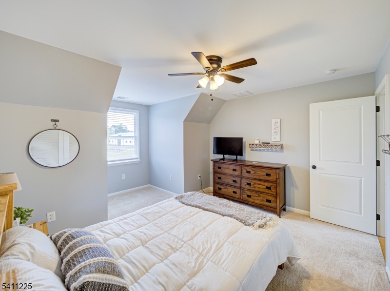33 Kappus Road Milford, NJ 08848 - Photo 41 of 50 a bedroom with a large bed and a chandelier