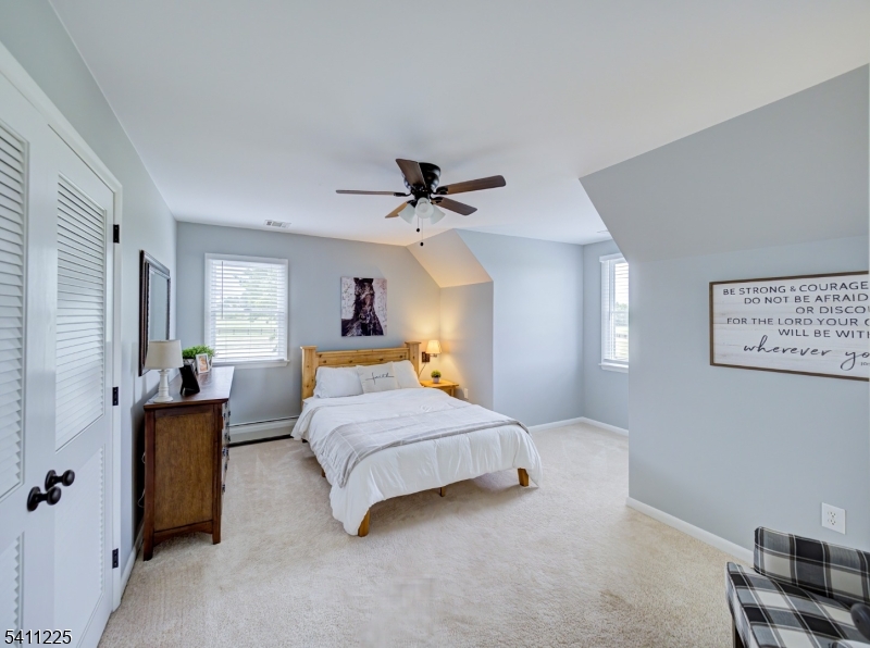 33 Kappus Road Milford, NJ 08848 - Photo 44 of 50 a bedroom with a bed and a chandelier