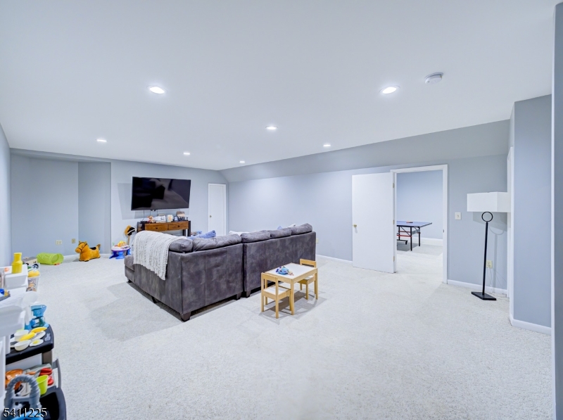 33 Kappus Road Milford, NJ 08848 - Photo 49 of 50 a living room with furniture and a flat screen tv