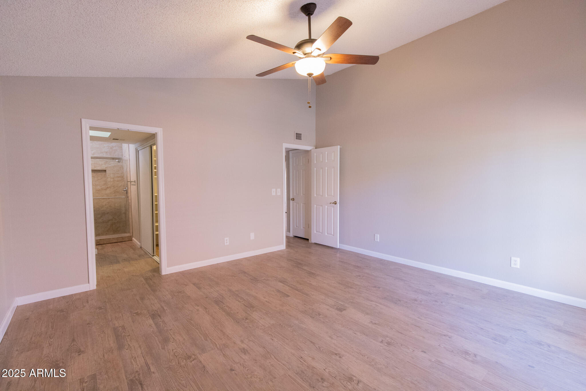 2034 South Paseo Loma Mesa, AZ 85202 - Photo 19 of 27 a view of an empty room with a ceiling fan