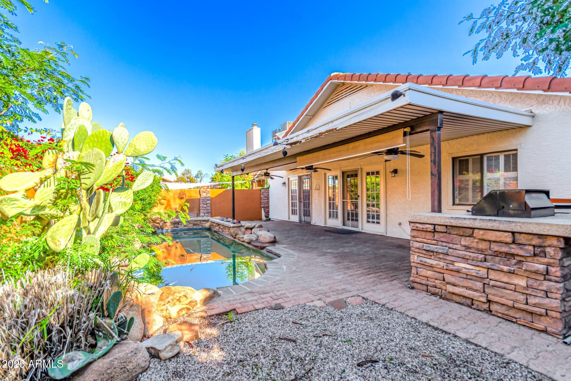 2034 South Paseo Loma Mesa, AZ 85202 - Photo 25 of 27 a front view of a house with a yard