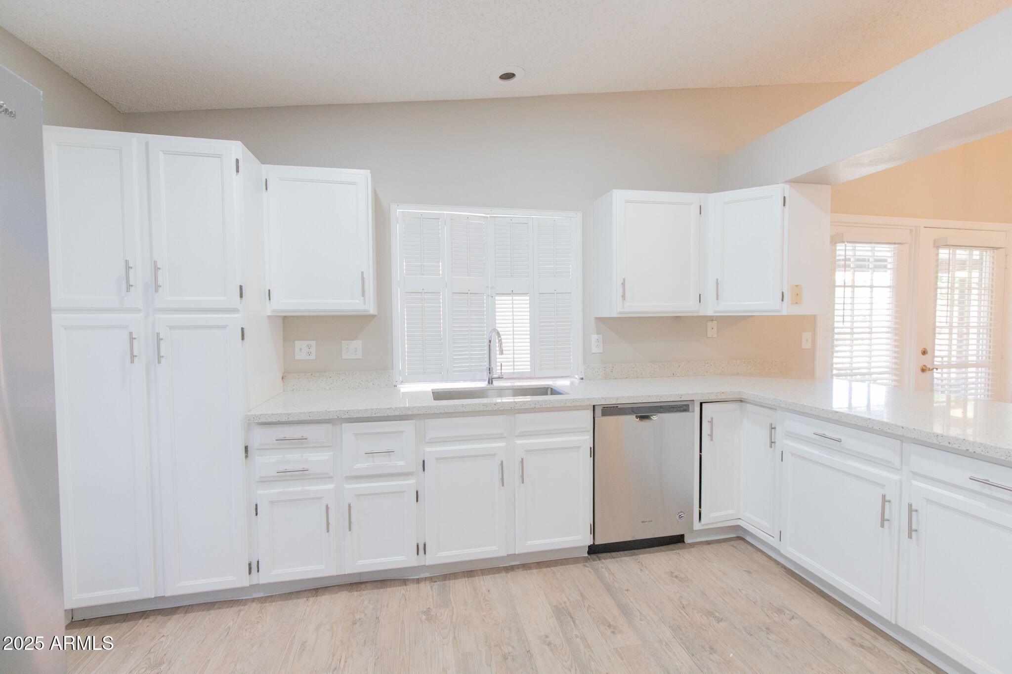 2034 South Paseo Loma Mesa, AZ 85202 - Photo 6 of 27 a kitchen with white cabinets