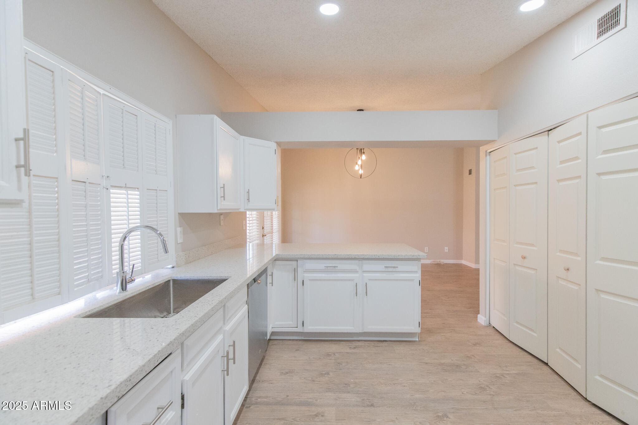 2034 South Paseo Loma Mesa, AZ 85202 - Photo 7 of 27 a kitchen with granite countertop a sink and cabinets