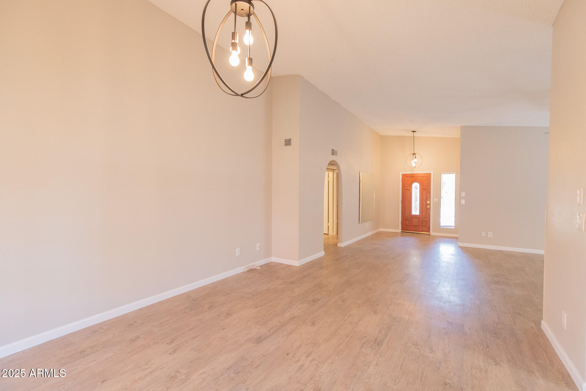 2034 South Paseo Loma Mesa, AZ 85202 - Photo 8 of 27 a view of an empty room with wooden floor