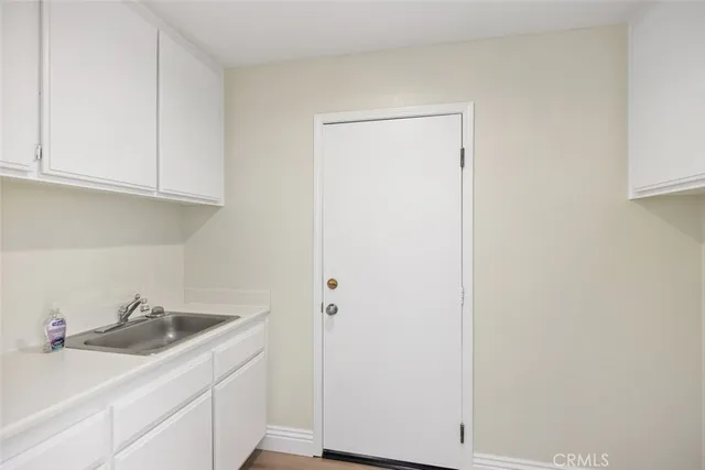 a kitchen with a sink and cabinets