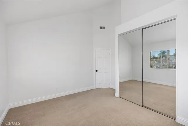 an empty room with sliding glass door