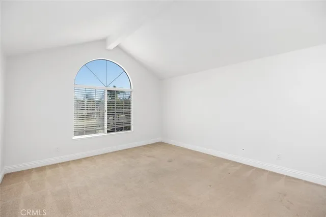 an empty room with a empty space and windows