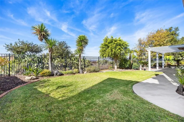 a view of a backyard with swimming pool