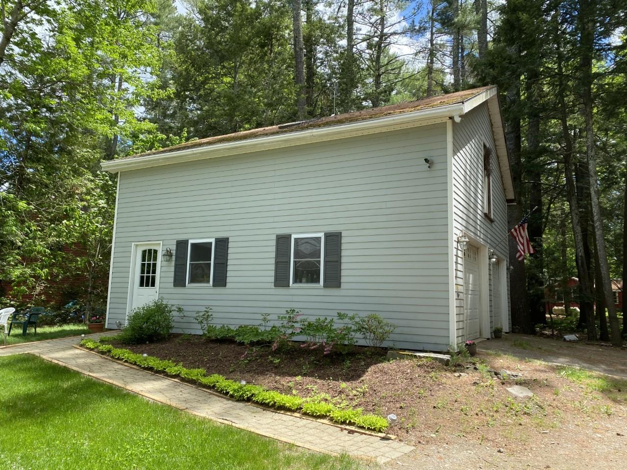 111 Hummingbird Lane Unity, ME 04988 - Photo 52 of 61 Side of garage and landscaping