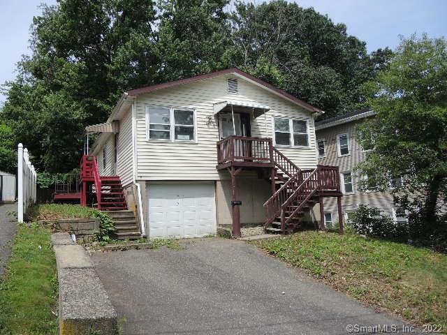 1184 Bank Street Waterbury, CT 06708 - Photo 1 of 1 a view of a house with a yard and large tree