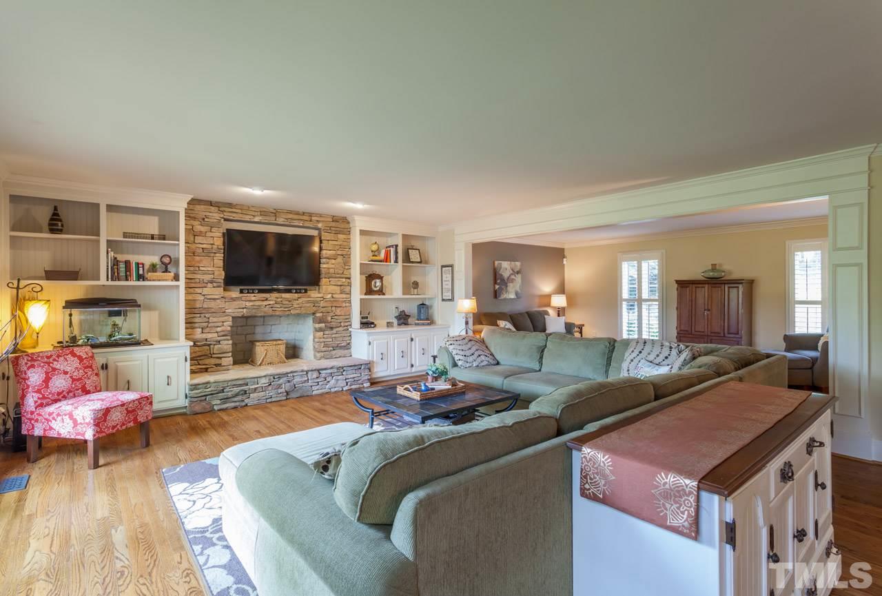1701 Hunting Ridge Road Raleigh, NC 27615 - Photo 3 of 4 a living room with furniture and a flat screen tv