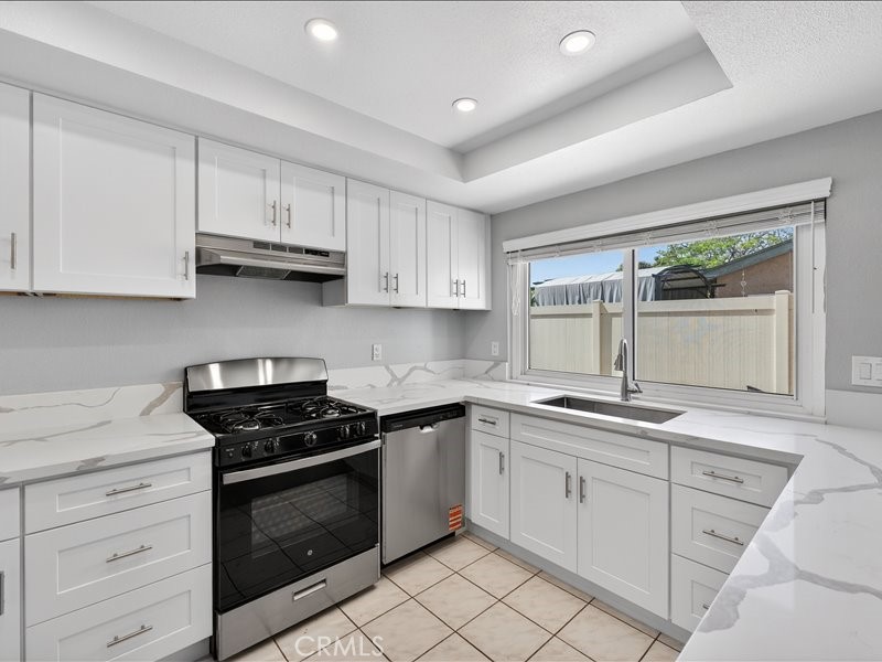 5442 Villa Way, Unit 4 Cypress, CA 90630 - Photo 2 of 42 Brand-new kitchen featuring modern cabinetry, sleek finishes, and stainless-steel appliances.