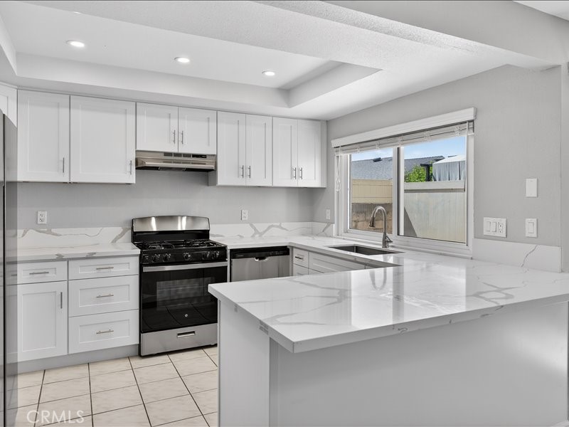 5442 Villa Way, Unit 4 Cypress, CA 90630 - Photo 3 of 42 Brand-new kitchen featuring modern cabinetry, sleek finishes, and stainless-steel appliances