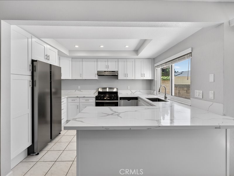 5442 Villa Way, Unit 4 Cypress, CA 90630 - Photo 4 of 42 Brand-new kitchen featuring modern cabinetry, sleek finishes, and stainless-steel appliances