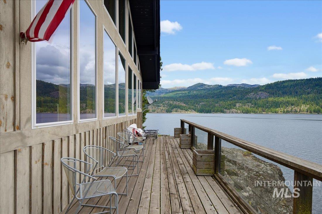 3800 Warren Wagon Road McCall, ID 83638 - Photo 33 of 50 Expansive outdoor deck featuring wood flooring and a glass panel railing