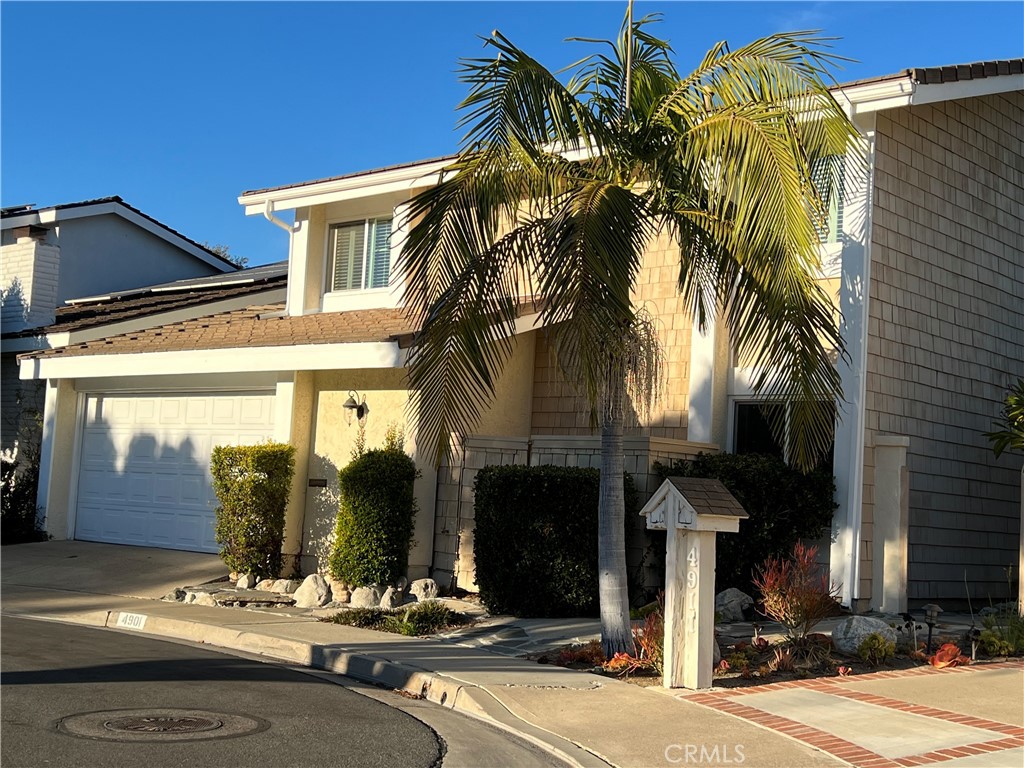 a view of a house with a street