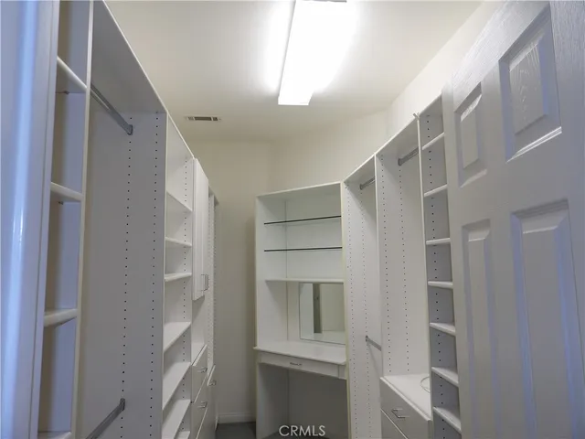 a living room with a fireplace and a chandelier