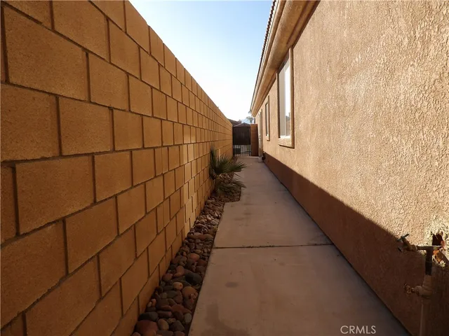 a view of a house with a dining table and chairs