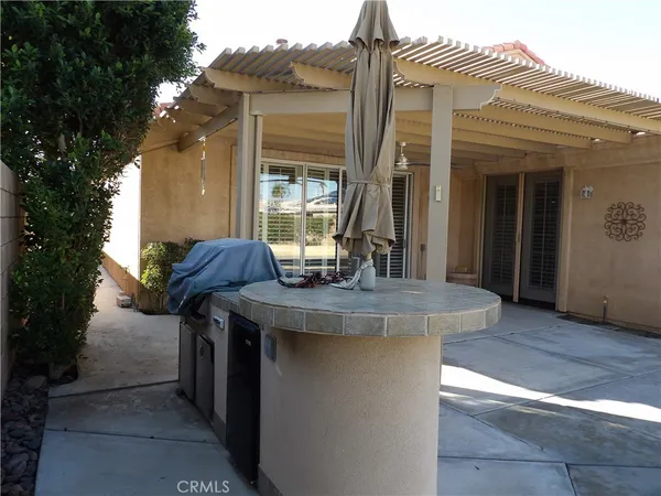 a view of house with outdoor space and sitting area