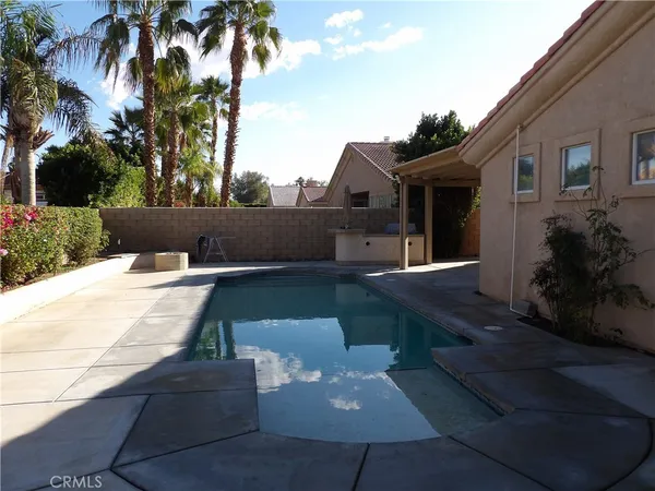 a terrace with a table and chairs