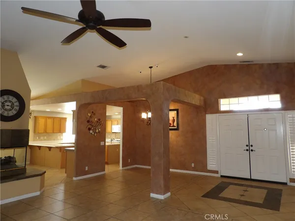 a view of a hallway with entryway wooden floor and front door