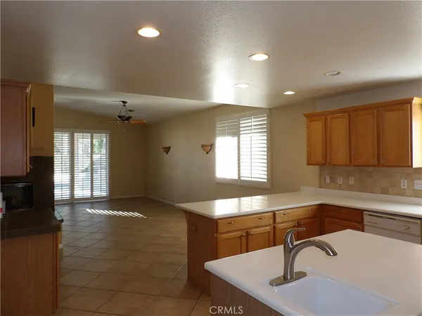 a kitchen with counter top space and sink