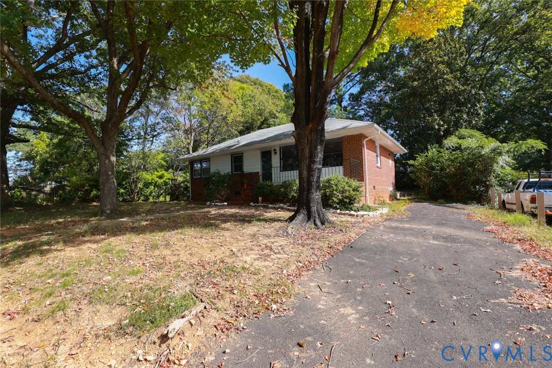 3007 Dunwick Road Richmond, VA 23230 - Photo 46 of 49 Brick and siding exterior with a partial covered p