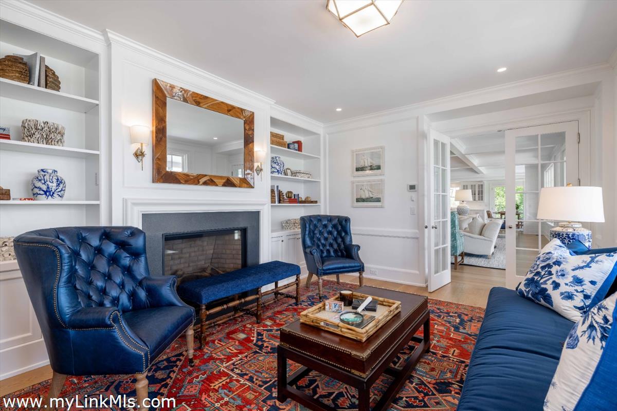 256 Polpis Road Nantucket, MA 02554 - Photo 6 of 30 a living room with furniture a fireplace and a flat screen tv