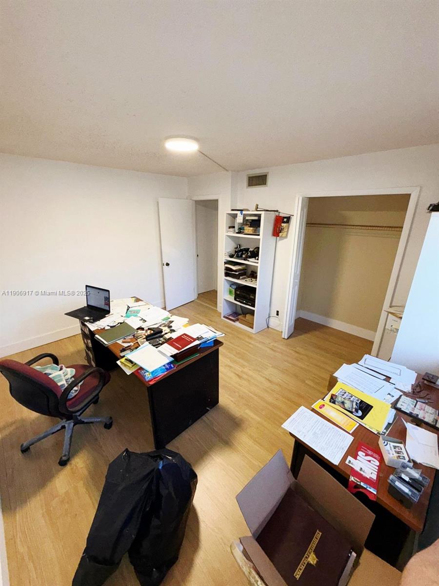 440 Lakeview Drive, Unit 102 Weston, FL 33326 - Photo 13 of 19 a living room with furniture and a wooden floor