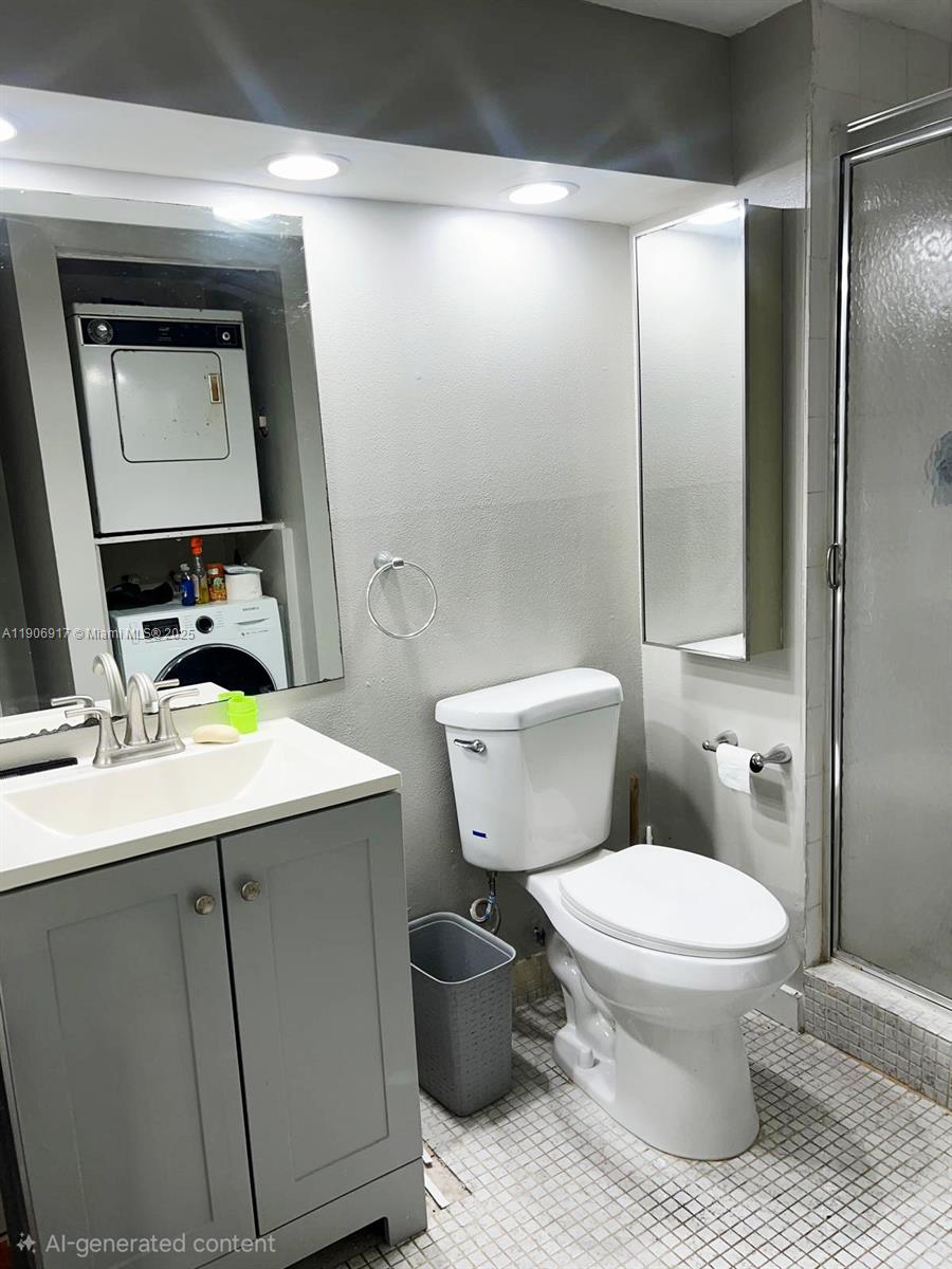 440 Lakeview Drive, Unit 102 Weston, FL 33326 - Photo 17 of 19 a bathroom with a toilet sink vanity and mirror