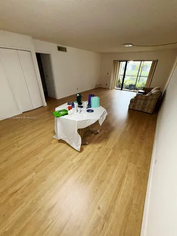 a bed sitting in a bedroom and room